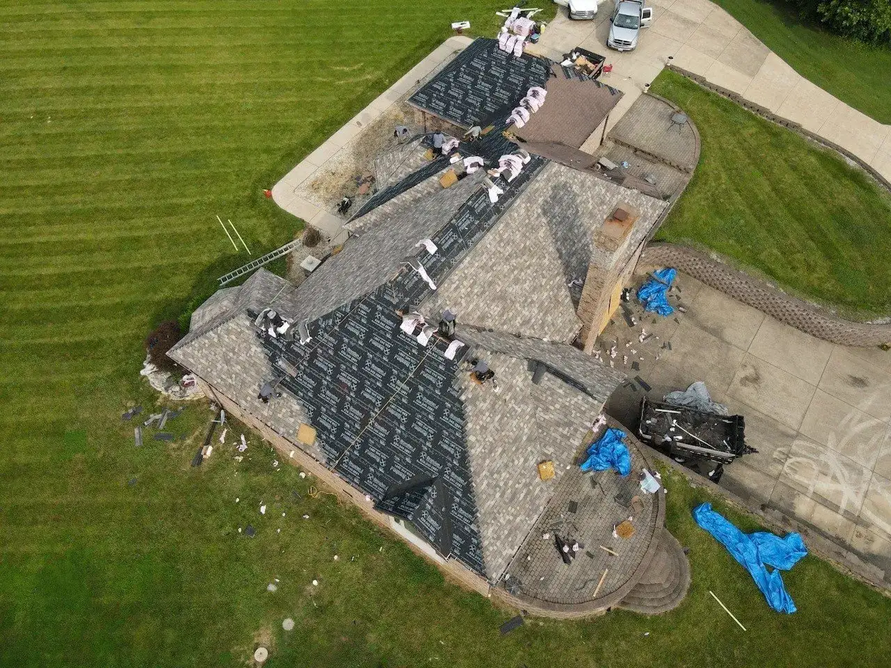 Brandon J Roofing project — aerial view of house roof under construction