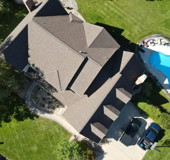 Aerial view of house with backyard and pool — Brandon J Roofing quality work