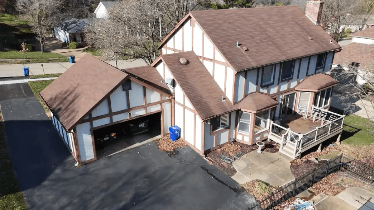 Roof before replacement showing aged, weathered shingles requiring renovation