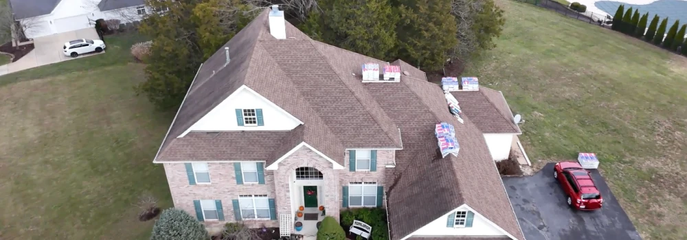 Roof before replacement — damaged shingles