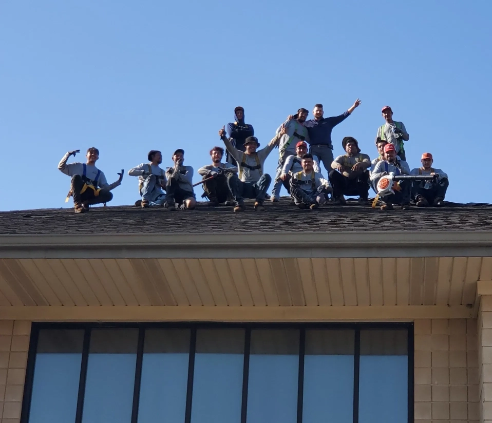team of best roofers on a roof in a commercial property in st charles, mo